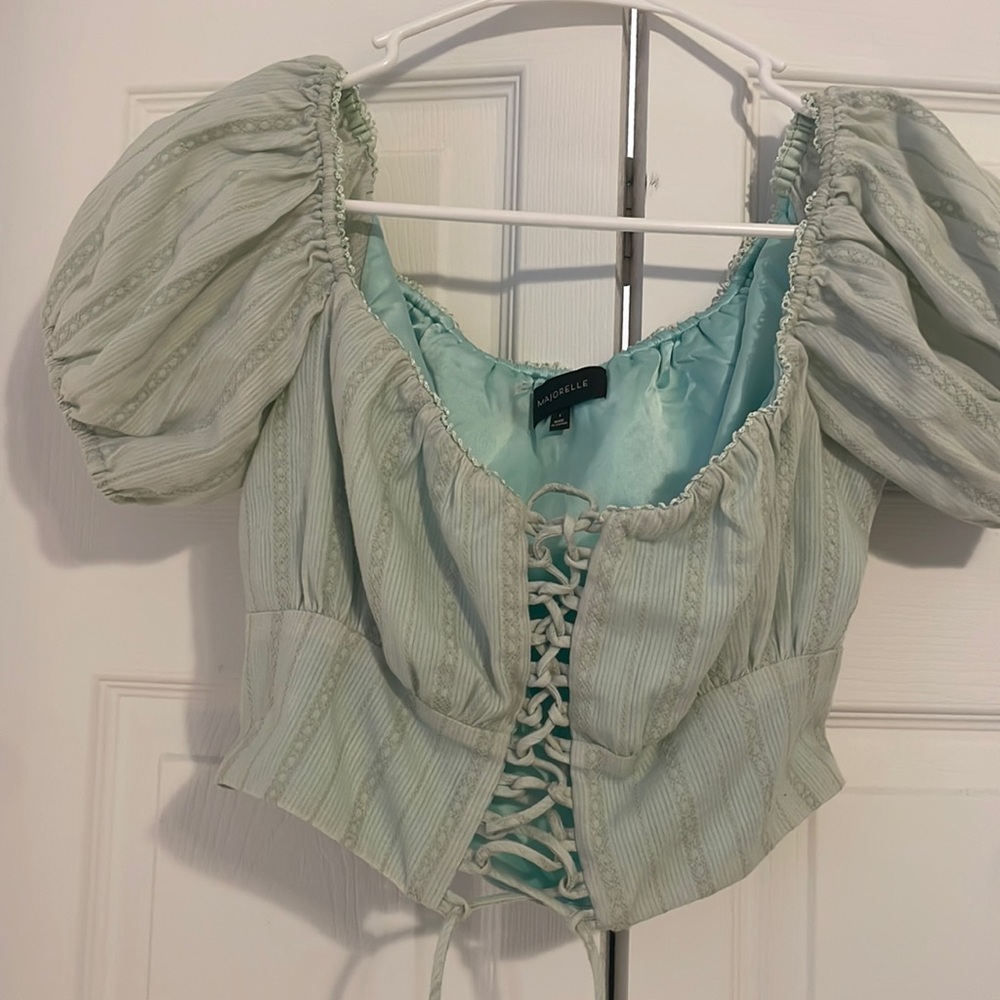 Gorgeous light turquoise color lace up top